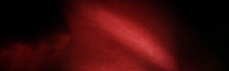 黑暗的红色的材料的质感的有用的背景